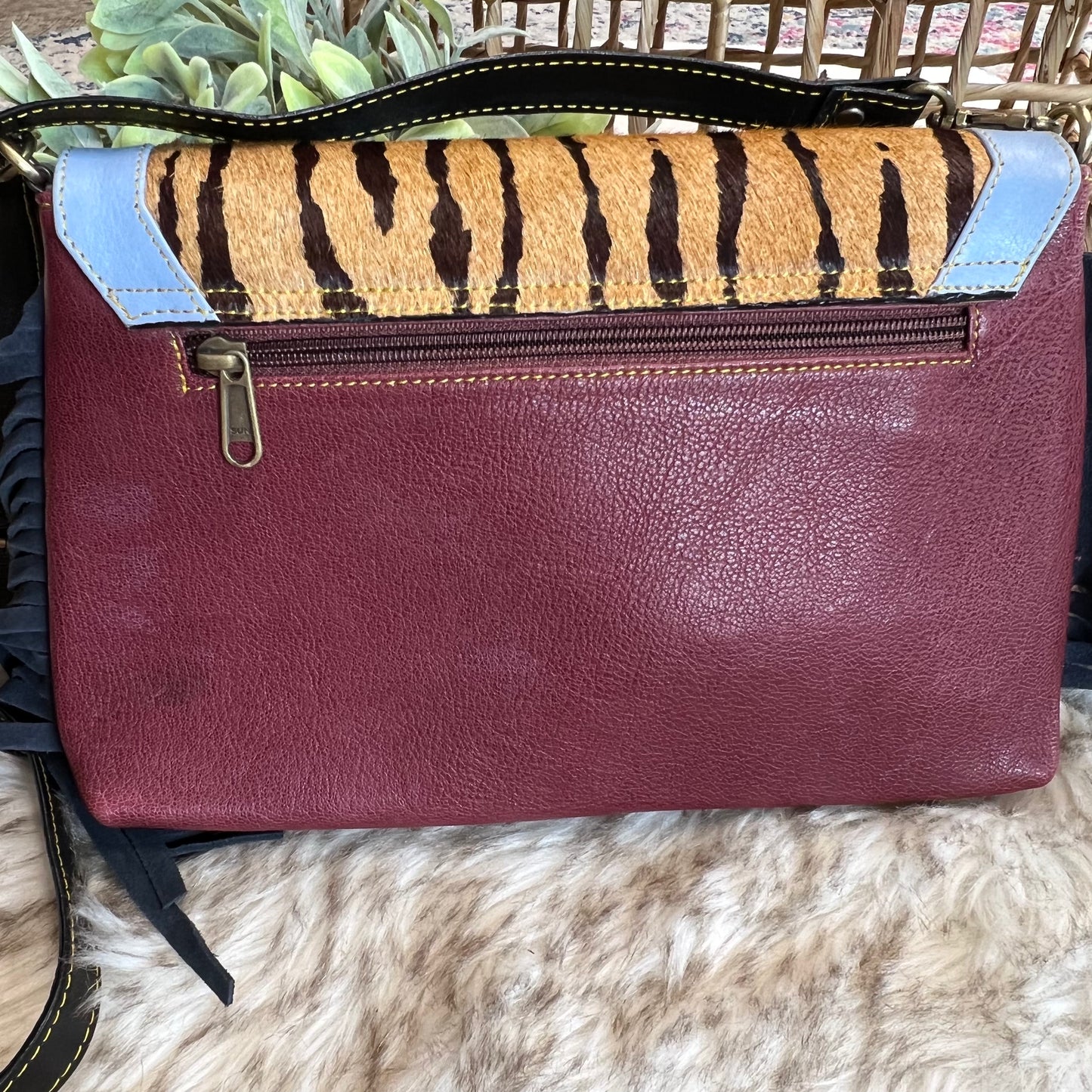 The Jules leather and hair on hide bag with fringe
