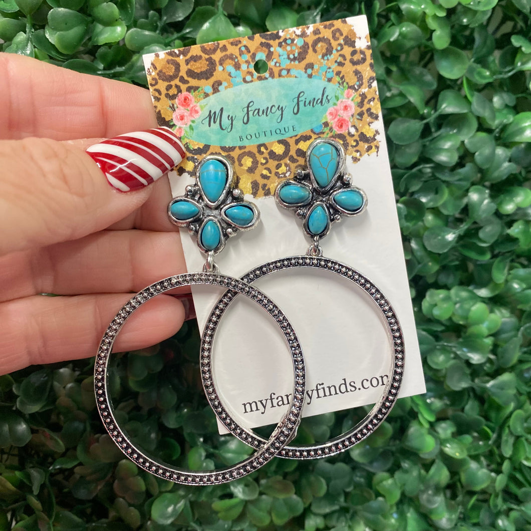 Silver hoop earring with a turquoise stone topper